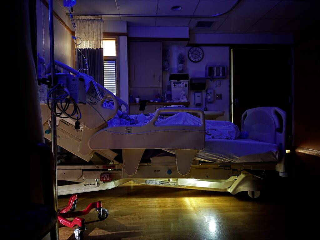 Brooklyn’s hospital room with soft lighting in the evening.